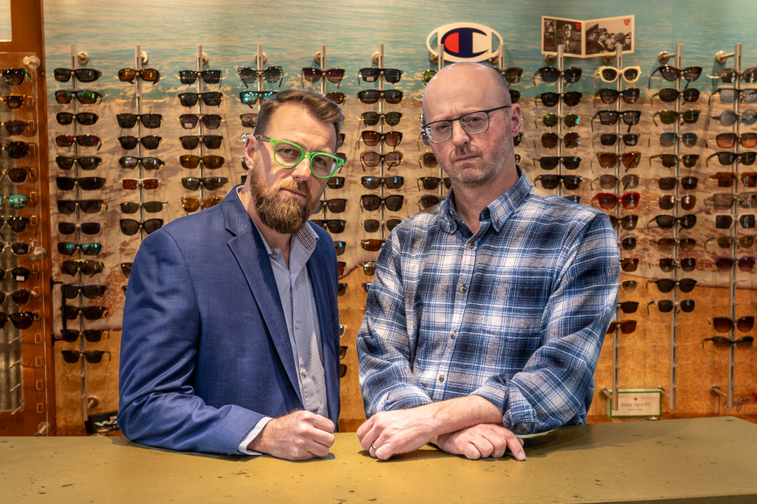 Jon__Ralph_behind_sun_counter_SERIOUS_FACES_374780(1) ModernEYES Optical